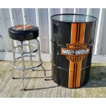 A Harley Davidson decorated oil drum/table with bar stool