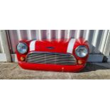 A fibreglass wall mounted Classic Mini Cooper front end, with lights