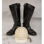 A Cromwell "The Noll" helmet, size 7 1/8, and a pair of Made in Britain leather riding boots, size 8