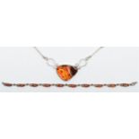 A silver and amber set necklace and similar bracelet, 32gm