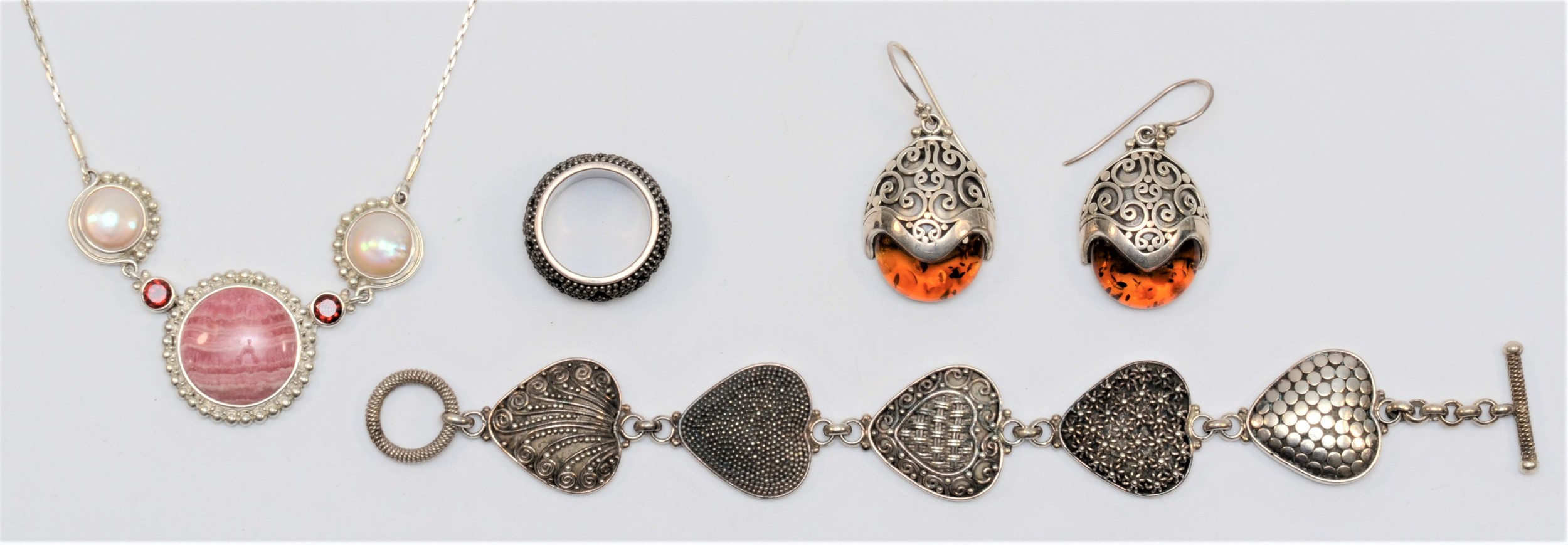 Suarti, a silver heart bracelet18cm, a pair of amber ear rings, a ring, all signed and a silver