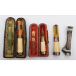 A Victorian silver mounted cigar piercer, Birmingham 1900, and three silver mounted amber and
