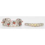A silver and opal set bangle, sprung on one side and a silver and coral bangle, 61gm