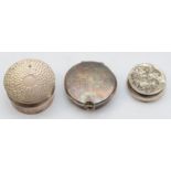 A silver wafer box, London 1950, gilt interior, an Edwardian silver pill box, Birmingham 1906 with