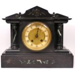 An Edwardian slate mantel clock, with green veined marble decoration, the 8 day movement striking on