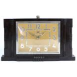 A 1950s Art Deco style bakelite mantel clock by Smiths, having a 30 hour movement, 17cm tall,