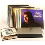 Twenty four LPs and 12" singles from Barry Manilow, together with twenty Barry Manilow singles and