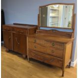 A early 20th century style dresser, upper mirror raised on a carved base, above small small