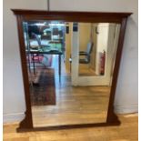 An Edwardian mahogany overmantle mirror, having bevel edge glass. 122x104cm