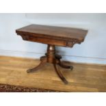 A early 19th century mahogany twist top occasional table, upper twists to reveal a storage compartm