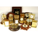 A collection mid 20th century and later mantel clocks, carriage clocks and wall barometers, having