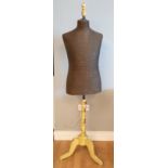 An early 20th century dressmakers mannequin, adjustable height, on trypod base.