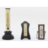 A F.J. Gold Optician Birmingham desk thermometer, 17cm tall, together with two smaller desk