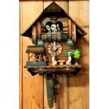 A mid 20th century Black Forest cuckoo clock, having a thirty hour musical movement.