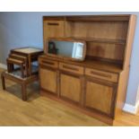 A mid 20th century Gplan display cabinet, with illuminated upper glass shelf, flanked by a single