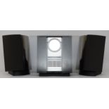 A Bang & Olufsen Beosound 2300 tuner and CD player, together with a pair of matching speakers on
