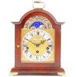 A modern Franz Hermie mahogany bracket clock, having chased brass dial, silvered chapter ring,
