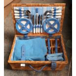 A wicker picnic hamper, fully fitted interior.