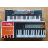 A Yamaha PSR F50 keyboard, with original box