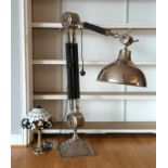 A modern floor standing anglepoise lamp, nickel plated, raised on a stepped base, together with a