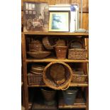 A collection of wickerwares, including various sized baskets, a picnic hamper, coal scuttles,