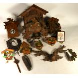 A collection of mid 20th century cuckoo clocks (spares or repair) together with a quantity of mantel