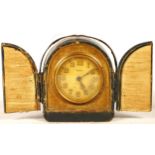 An Edwardian French bedside alarm clock, having 8 day movement and traveling case, together with a