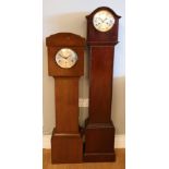 Two Edwardian mahogany cased Grandmother clocks, having 8 day movements, striking on gongs.