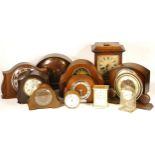 Three boxes of mantel clocks, together with three Vienna style wall clocks and a wall barometer,