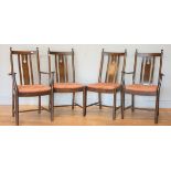 A set of four mid 20th century Ercol dining chairs, 2+2 carvers, high-backed with removable seat pa