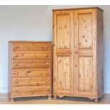 A Ducal stained pine chest of drawers, six equally sized drawers with bun handles, on bun feet, 88 x