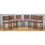 Six Edwardian dining chairs, oak framed with leather back rest and seat, metal stud work decoration,