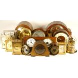 A collection of mechanical and quartz clocks, to include travel, mantel, desk, carriage,