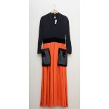 Doree Leventhal Ltd long sleeved, orange and black, full length dress with sequinned black patch