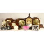 A collection of quartz and mechanical clocks, to include mantel, carriage, alarm clocks and more (4)