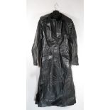 A 1970's full length black, button through, single vented belted leather coat purchased around 1977,