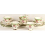 A Gladstone bone china tea set, Rosewood pattern, consists of six tea cups, six saucers and six side