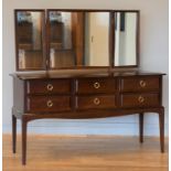 A Stag Minstrel dressing table, with attached triple mirror, three small drawers over three small