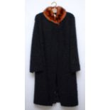 A satin lined natural black persian lamb/astrakhan, fur collared coat, size C40" L45".