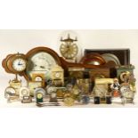 A collection of mechanical and quartz clocks, including lantern, alarm, novelty, miniature,