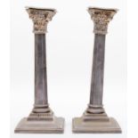 A silver pair of Corinthian column candlesticks, Birmingham 1939, with detachable sconces, 22.5cm,