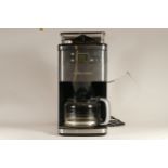 A Andrew Jones bean to cup coffee machine, programmable with grind settings
