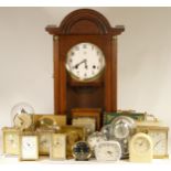 A collection of mechanical and quartz clocks, including alarm, wall, mantel, carriage and more, also