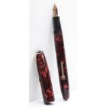 Conway Stewart, a red mottled fountain pen with 14ct gold nib,