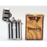 Thorens, an Art Deco semi automatic chrome and black enamel petrol lighter, model 2603, apparently