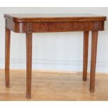 A late 19th century mahogany swivel top table, twisted to reveal internal storage, on tapered