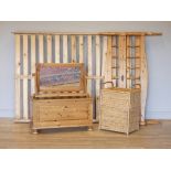 A pine double bed frame, on turned legs, together with a pine blanket box, panelled sides on bun