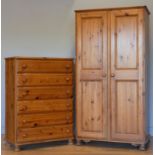 A Ducal stained pine chest of drawers, six equally sized drawers with bun handles, on bun feet, 88 x