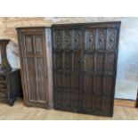 A late 19th century oak double wardrobe, with panel fronted decoration, two hinged doors open to
