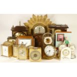 A collection of mechanical and quartz clocks, to include a Sunburst wall clock, anniversary